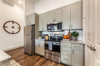 Chef-inspired open kitchen with glass blacksplash